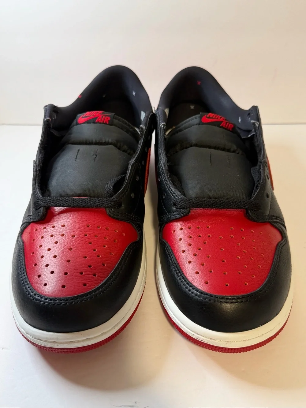 Jordan Low Top Sneaker in Black and Red